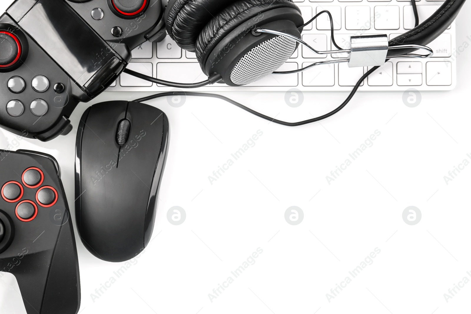 Photo of Flat lay composition with computer mouse and gaming gear on light background