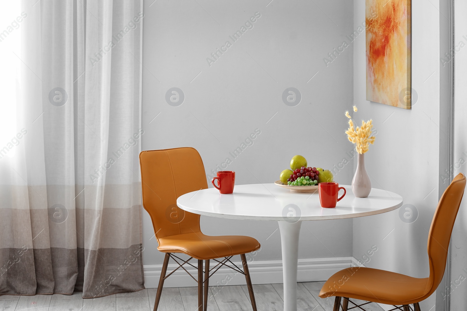 Photo of Stylish dining room interior. Home design idea