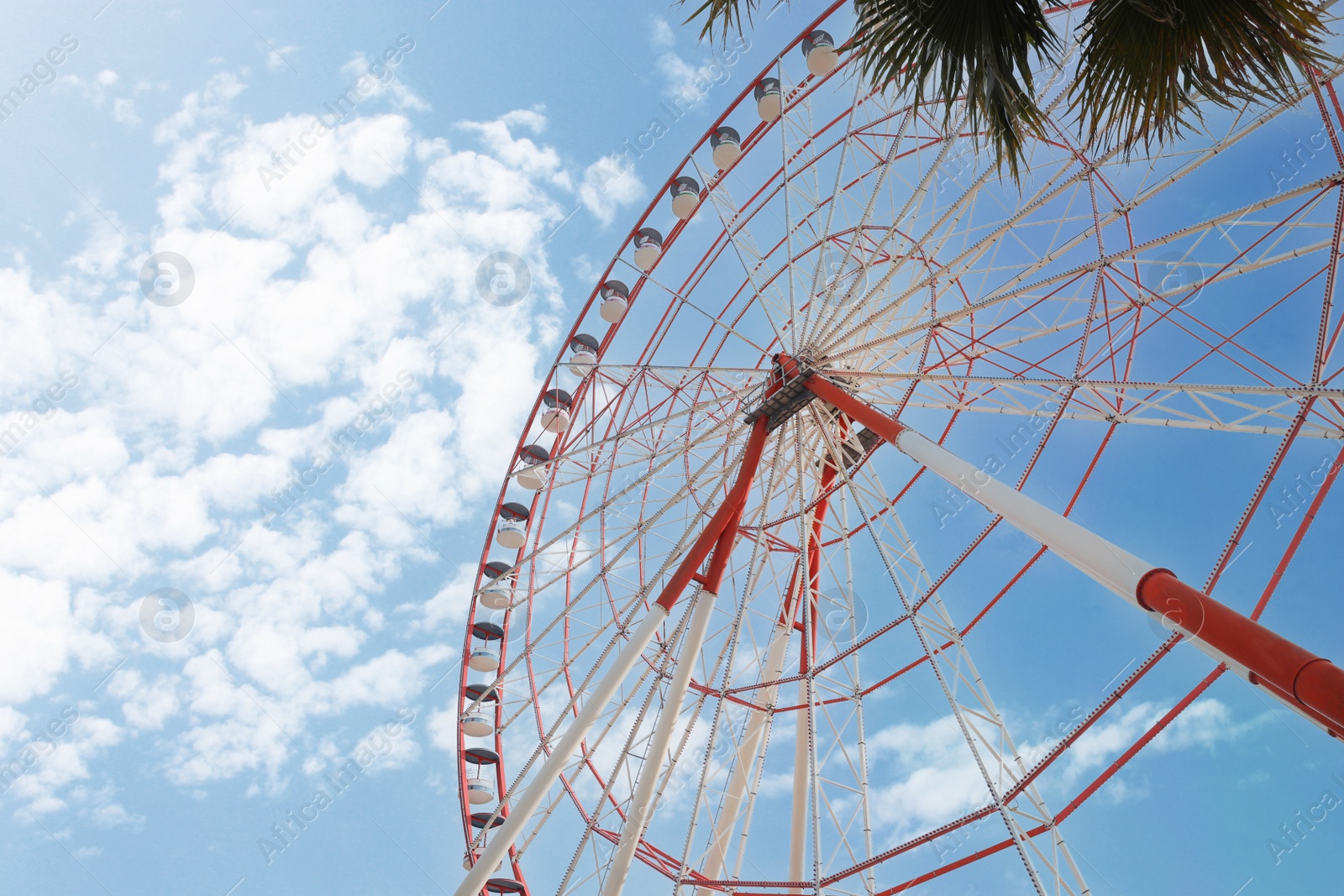 Photo of Beautiful large Ferris wheel outdoors, low angle view. Space for text