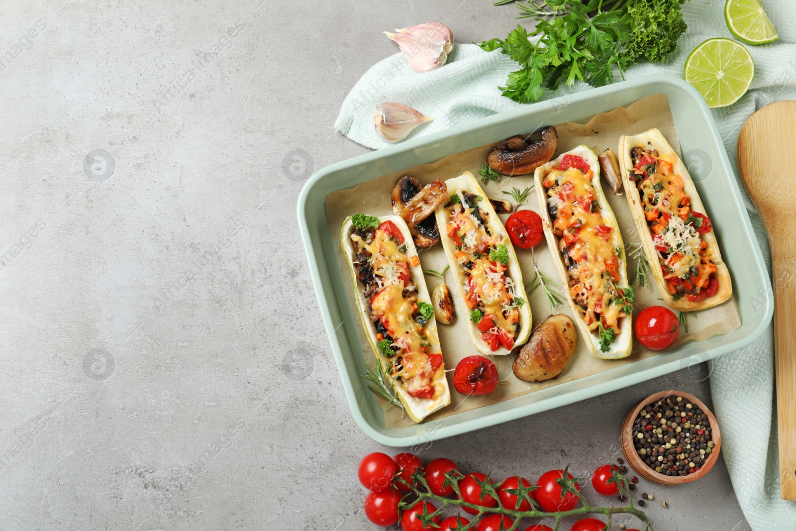 Photo of Flat lay composition with delicious stuffed zucchini on light grey table