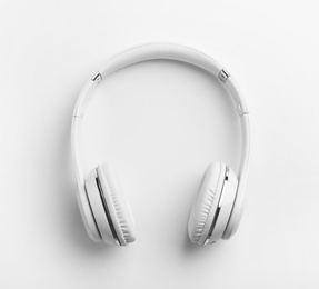 Photo of Stylish modern headphones with earmuffs on white background