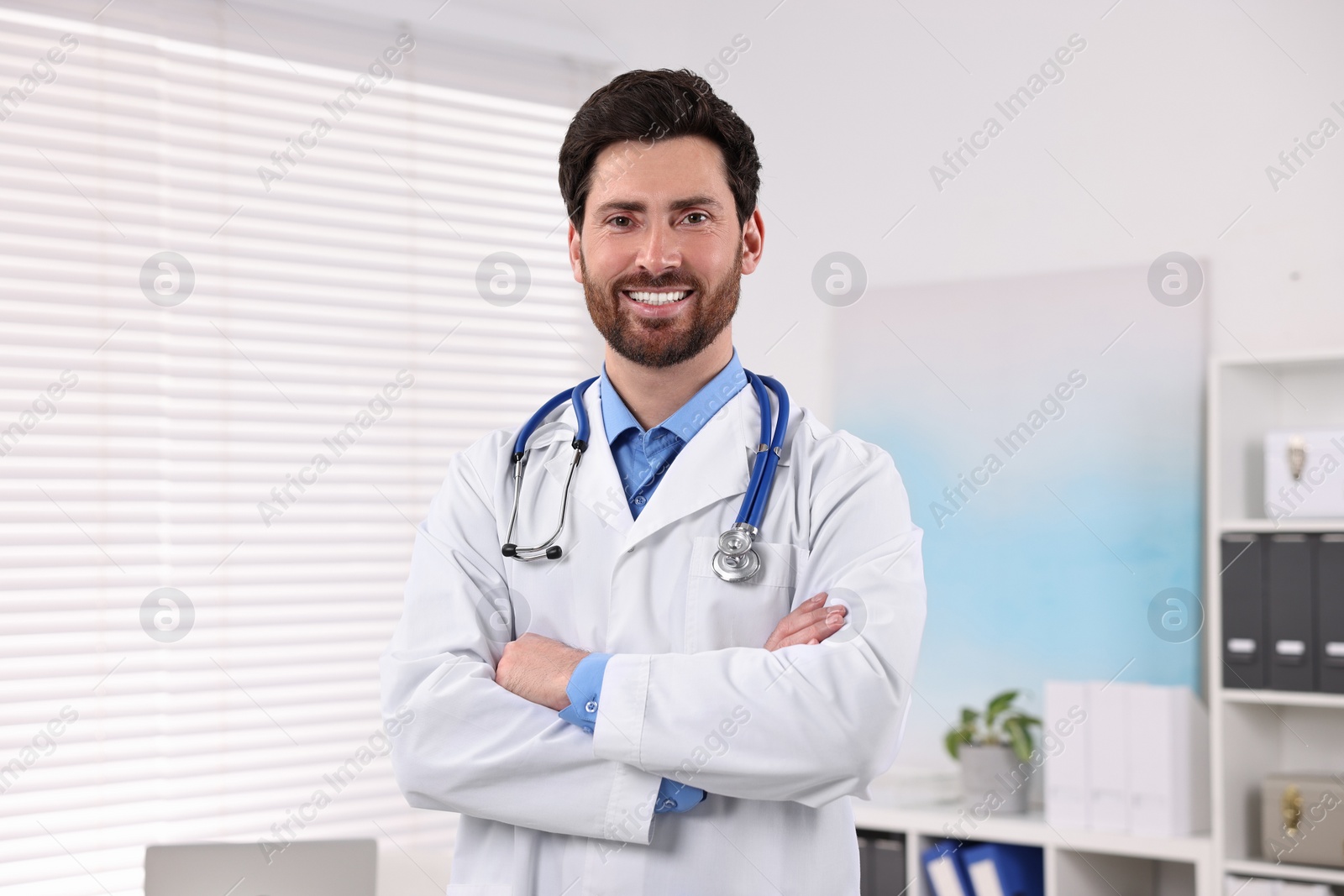 Photo of Portrait of medical consultant with stethoscope in clinic