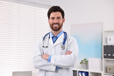 Photo of Portrait of medical consultant with stethoscope in clinic