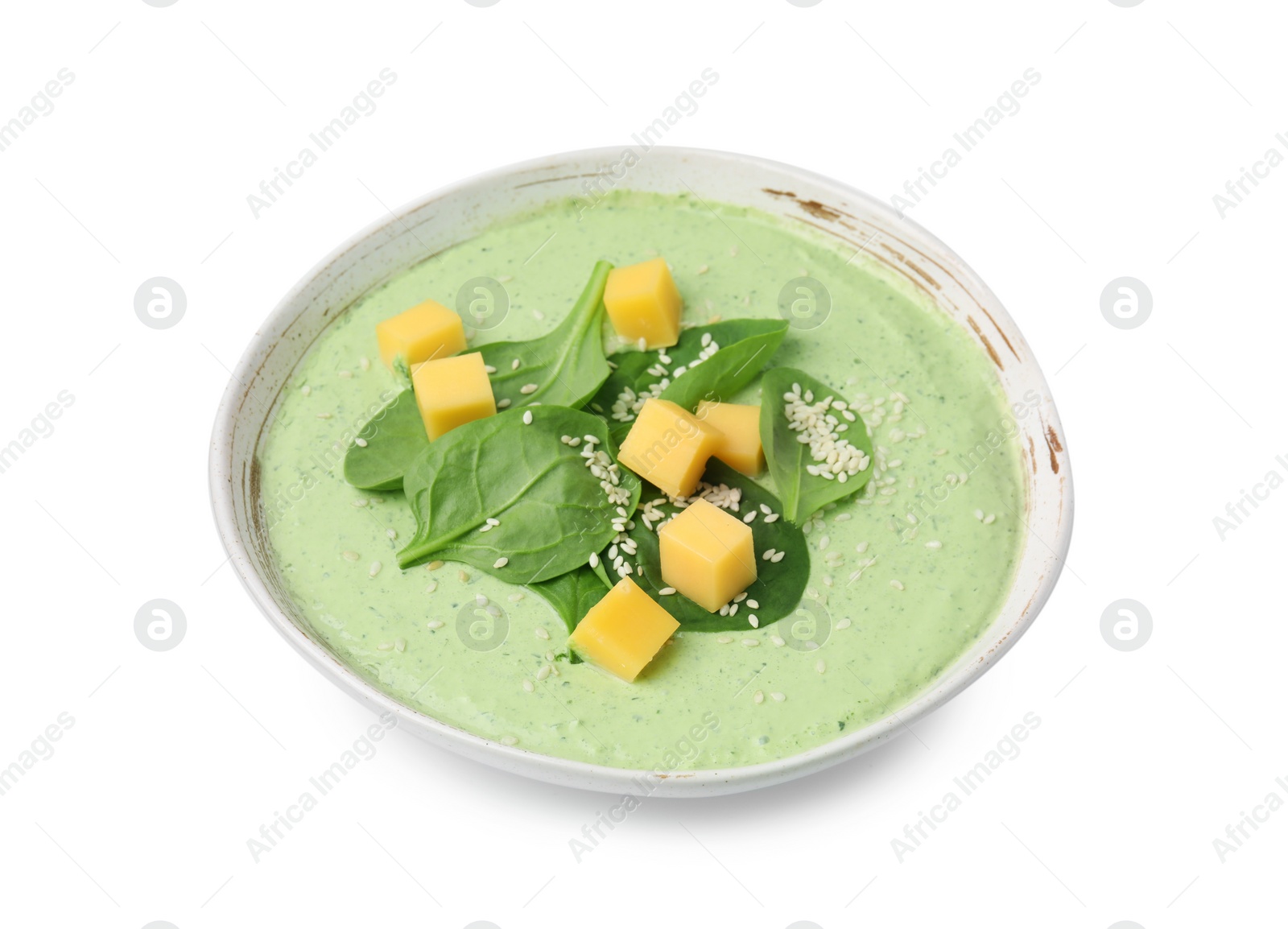 Photo of Delicious spinach cream soup with cheese and sesame seeds in bowl isolated on white