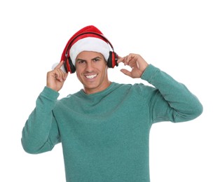 Photo of Happy man with headphones on white background. Christmas music