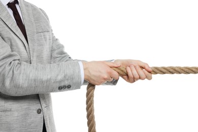 Photo of Dispute concept. Businessman pulling rope on white background, closeup
