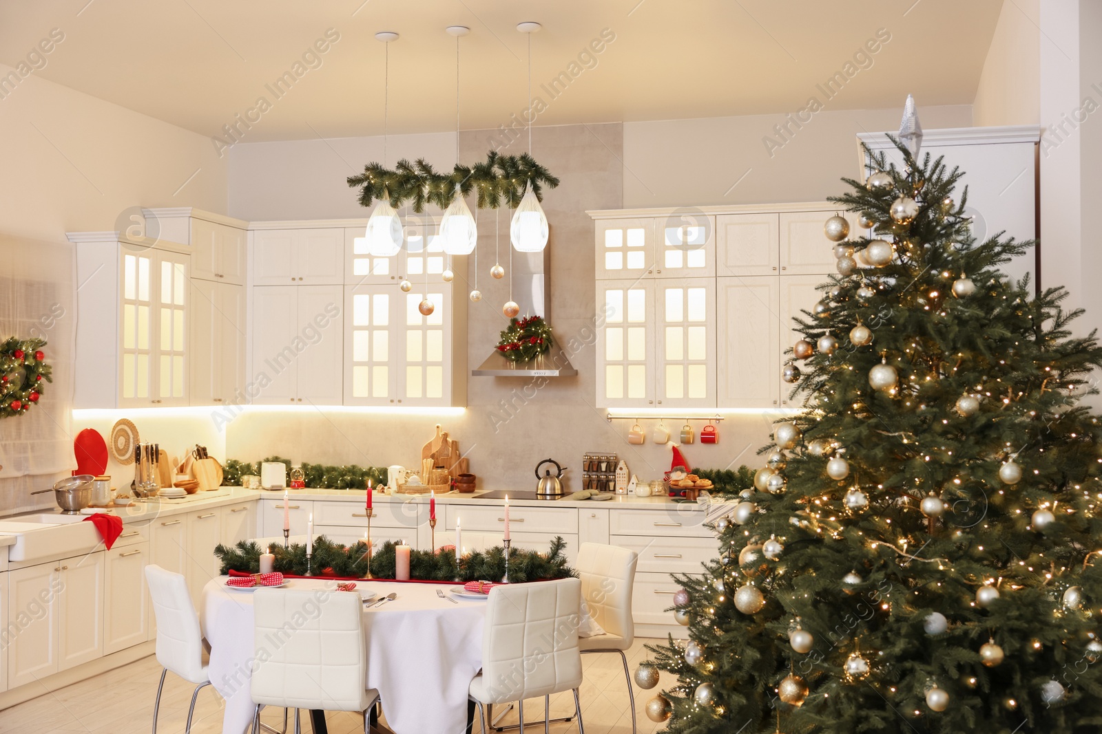 Photo of Cozy spacious kitchen decorated for Christmas. Interior design