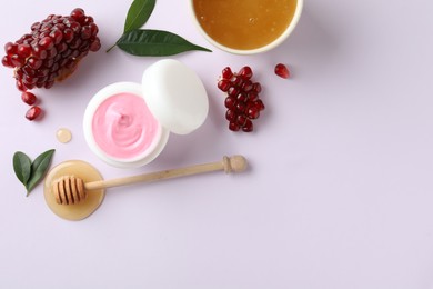 Composition with natural homemade mask, pomegranate and ingredients on white background, top view
