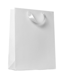 Photo of Paper shopping bag isolated on white. Mock up for design