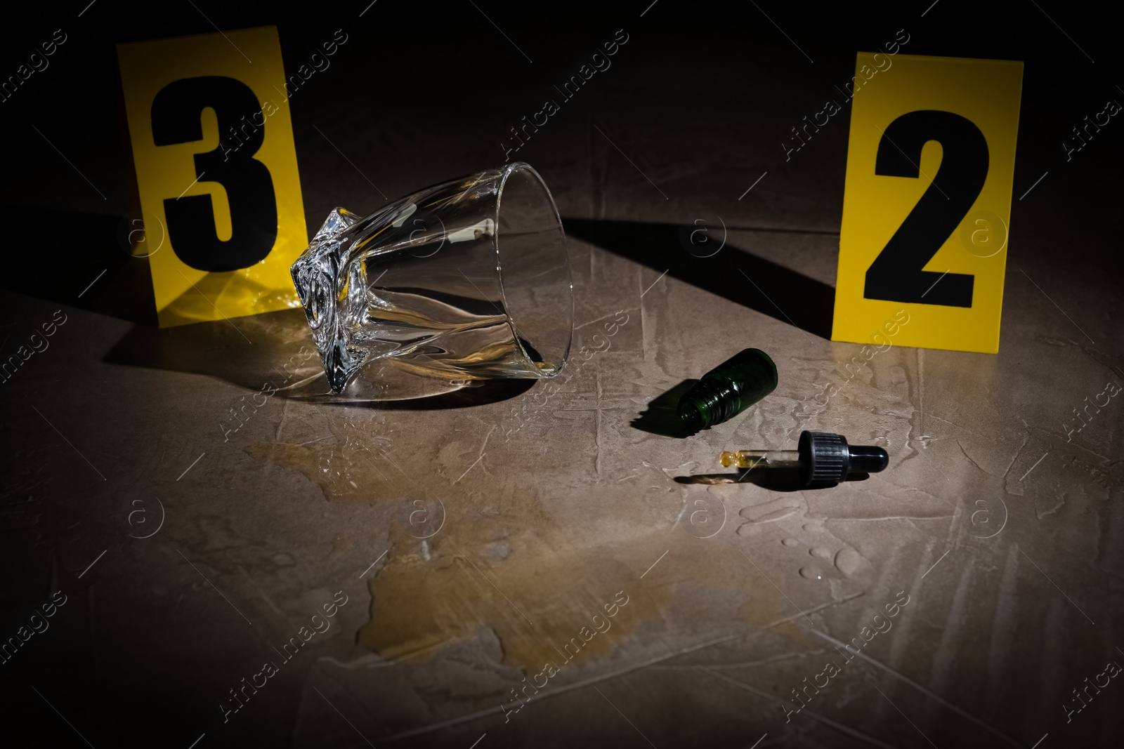 Photo of Crime scene markers and evidences on grey stone table