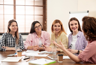 Photo of Female professional business team working in office. Women power concept