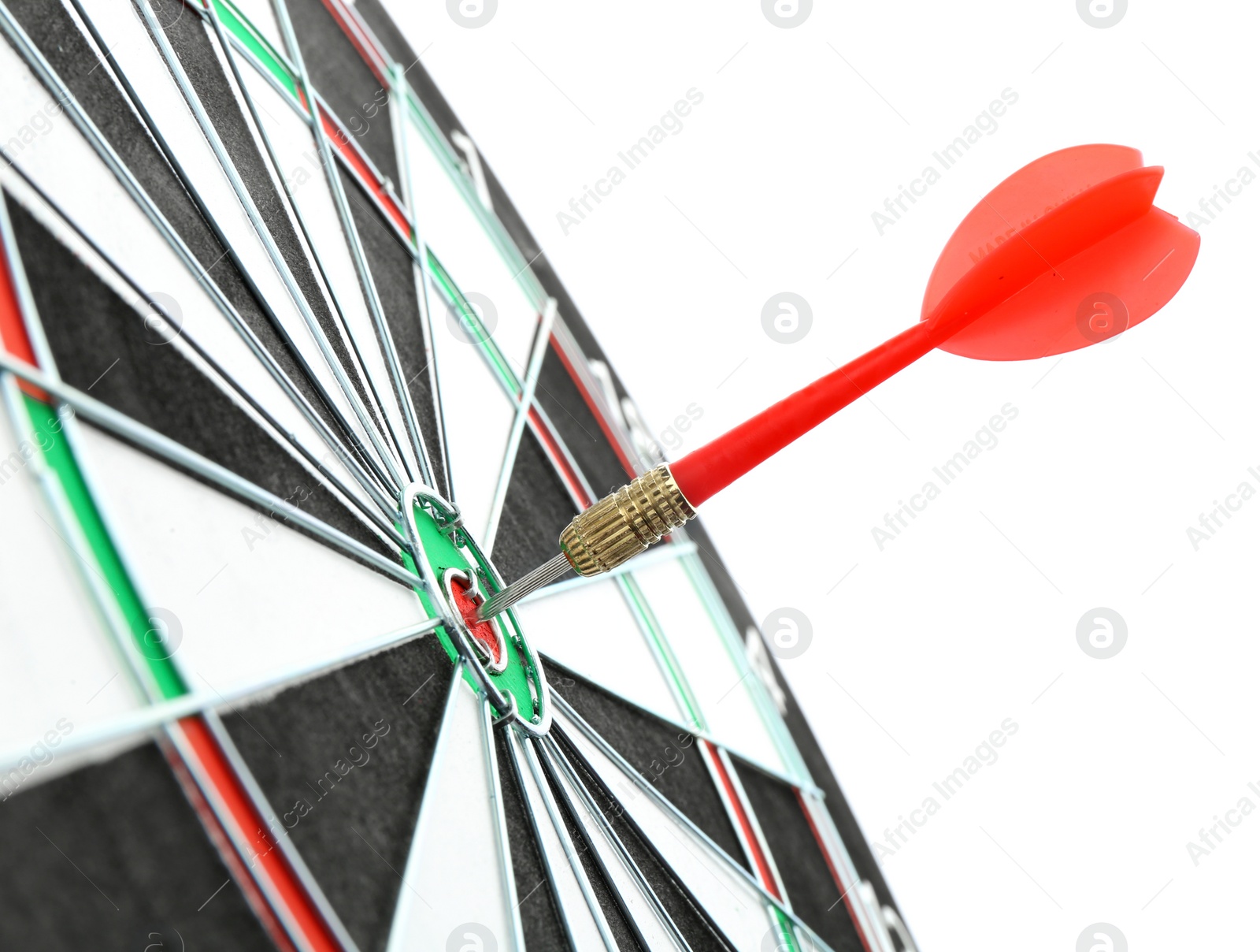 Photo of Dart board with color arrow hitting target, closeup