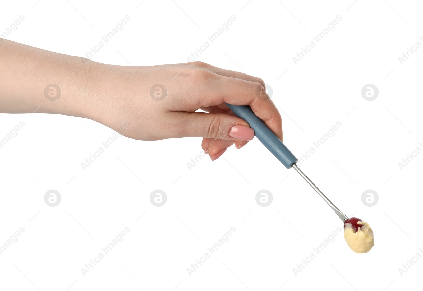 Photo of Tasty fondue. Woman holding fork with grape and melted cheese on white background, closeup