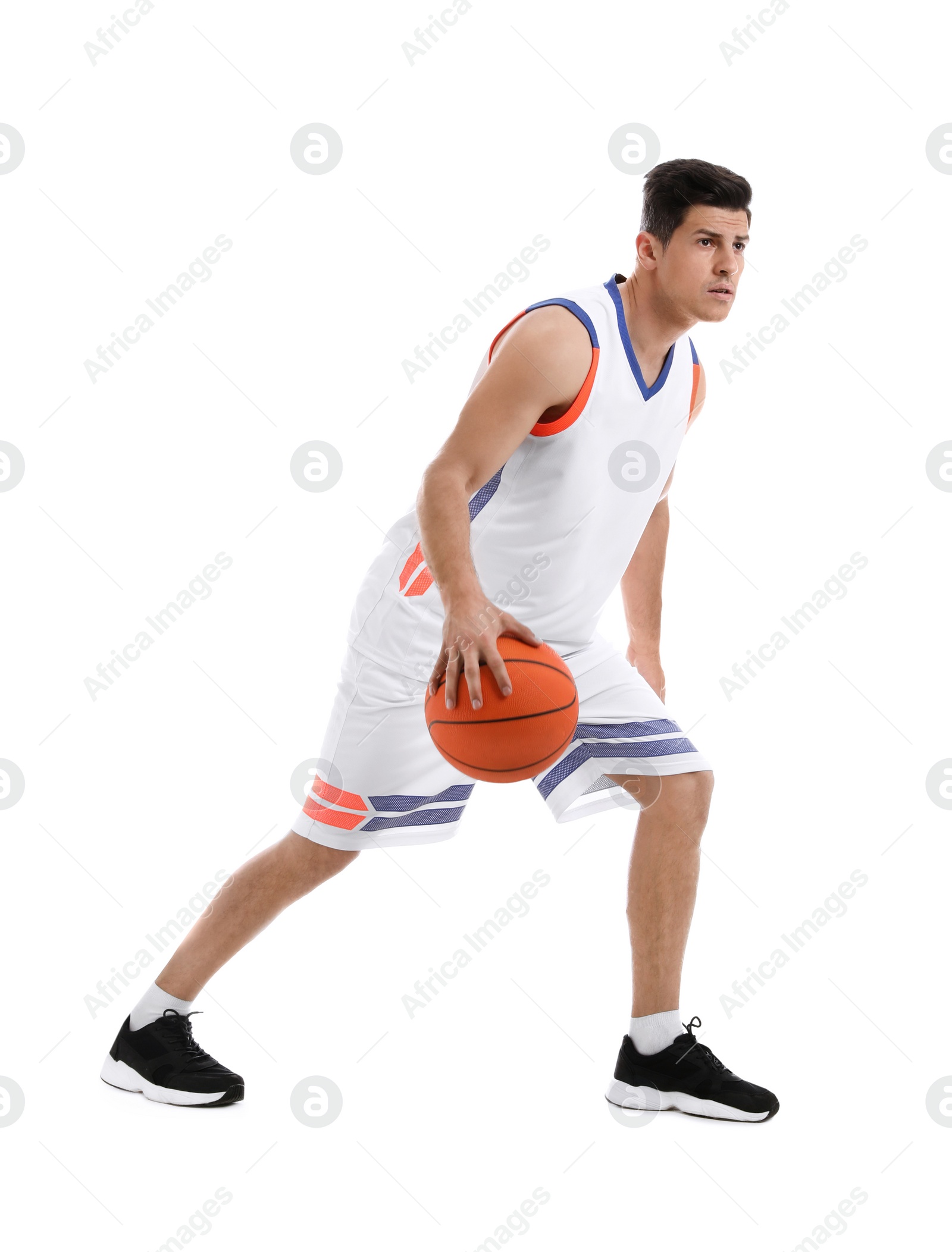 Photo of Professional sportsman playing basketball on white background