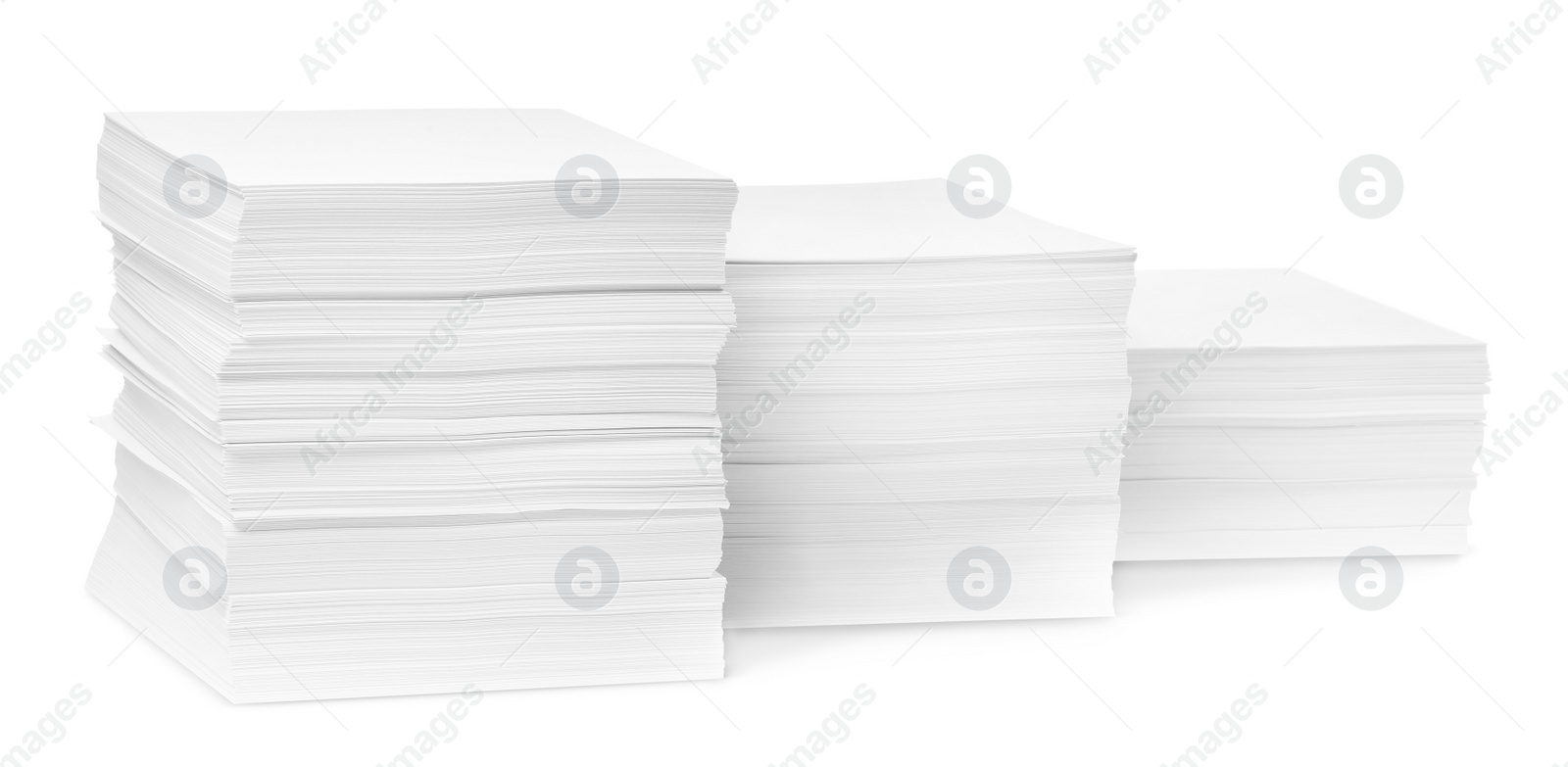 Photo of Stacks of paper sheets on white background