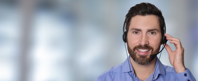Hotline operator with headset in office, space for text. Banner design