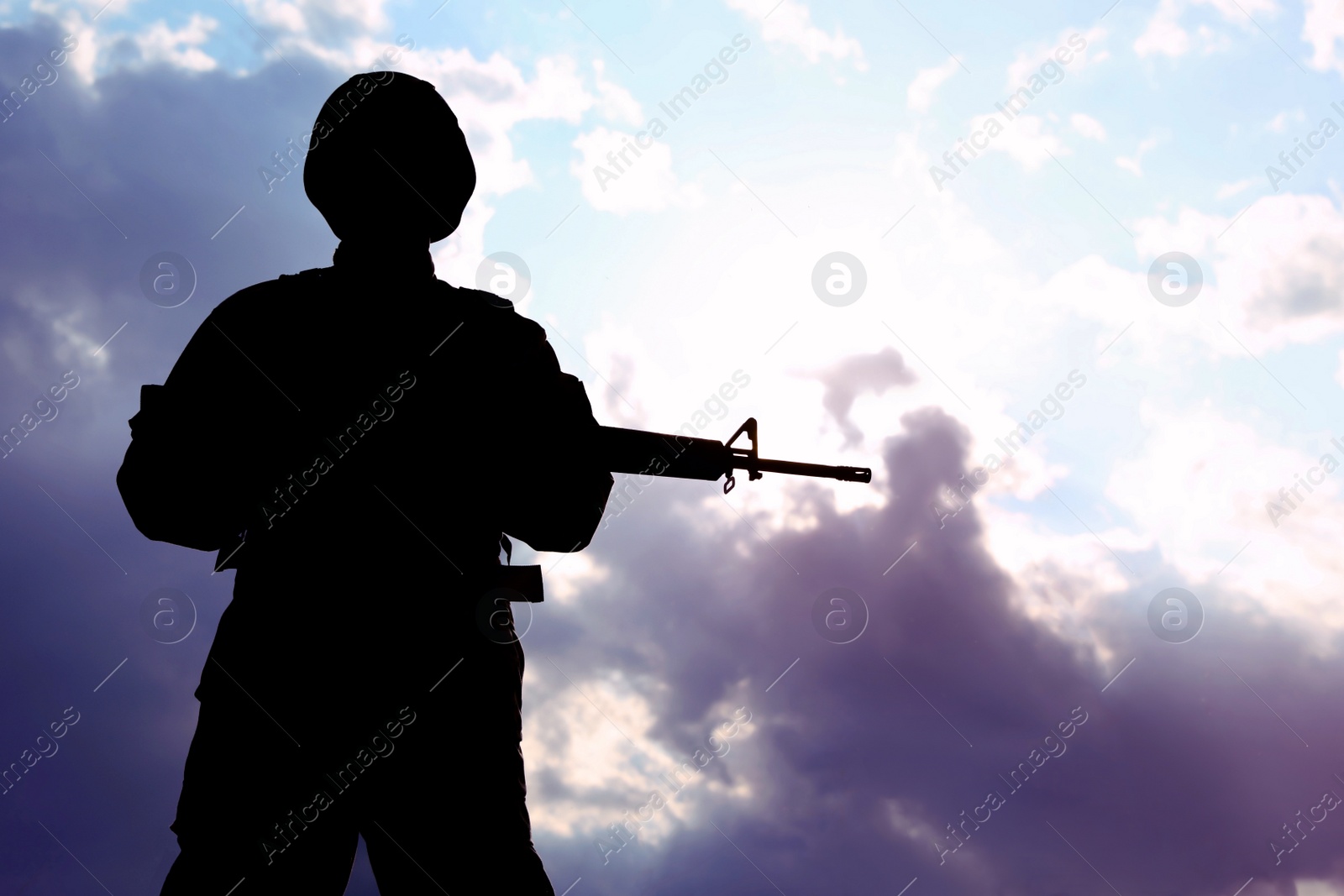 Photo of Soldier with machine gun patrolling outdoors. Military service