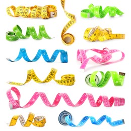 Image of Set with different measuring tapes on white background