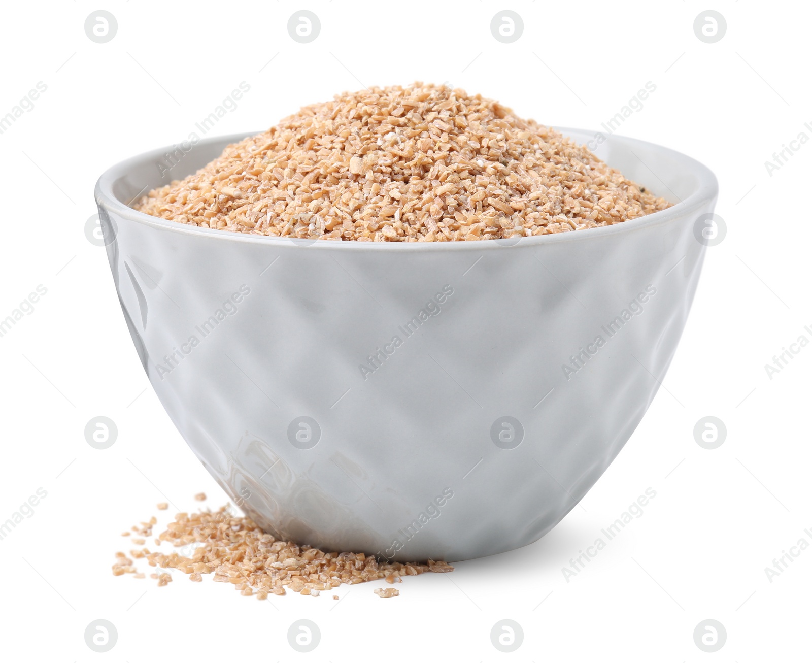 Photo of Dry wheat groats in bowl isolated on white