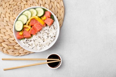 Delicious poke bowl with salmon, rice and vegetables on white table, flat lay. Space for text
