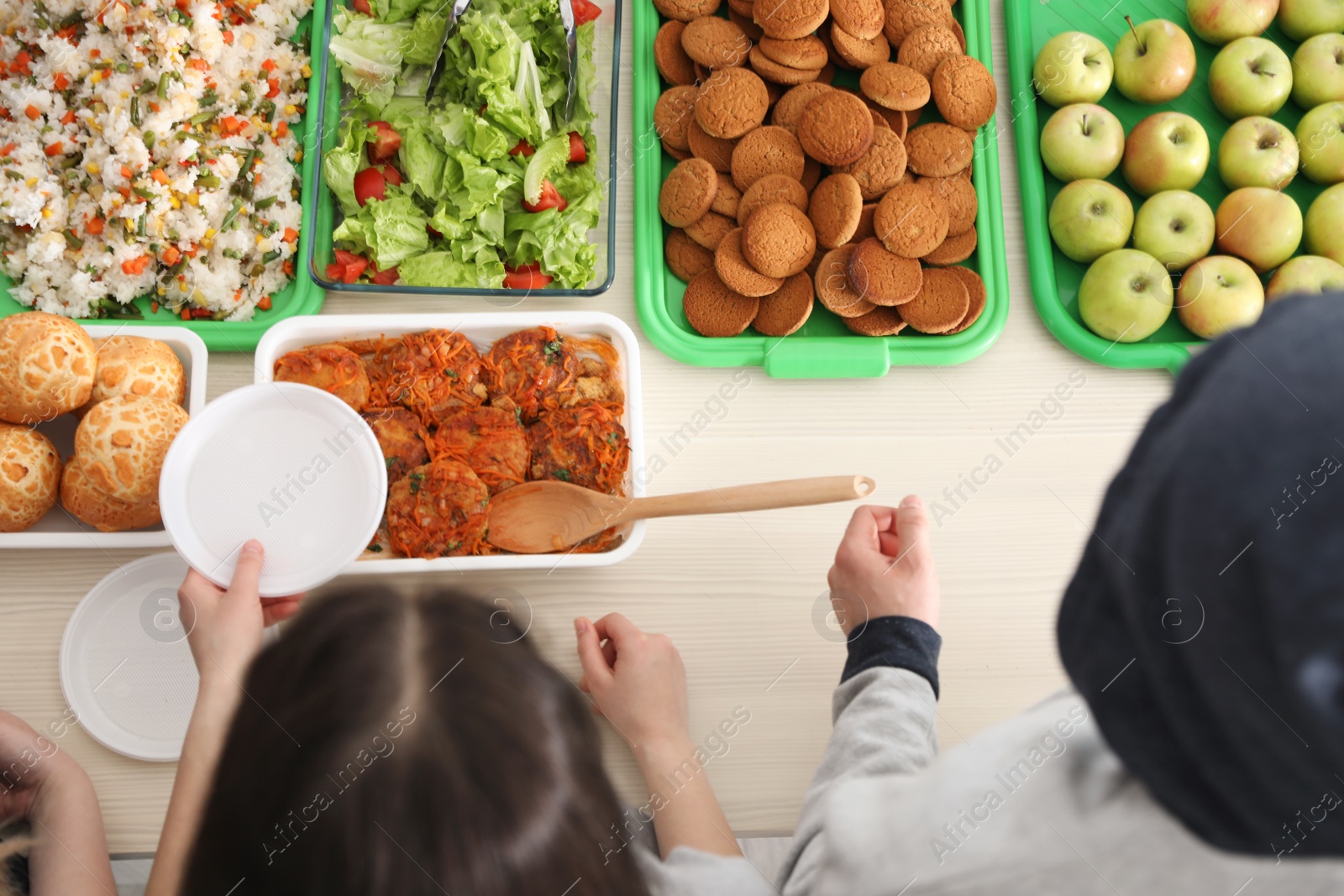 Photo of Table with food prepared by volunteers for poor people, top view