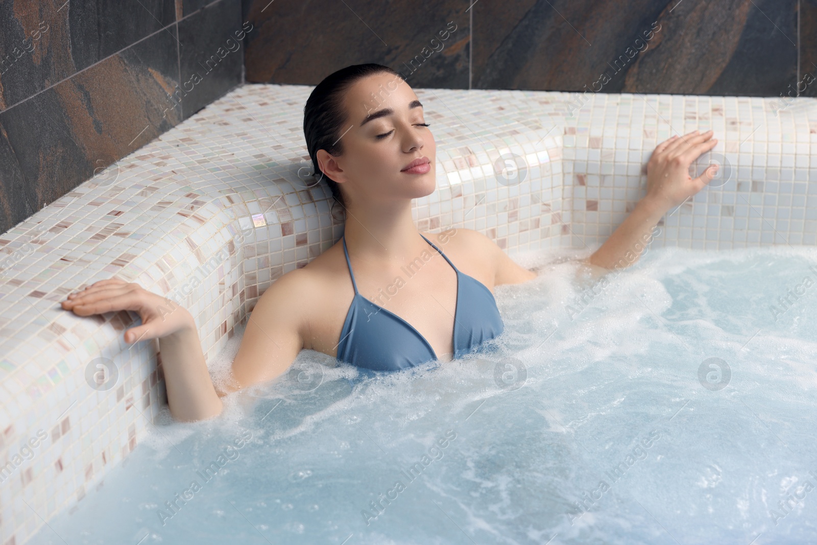 Photo of Beautiful woman relaxing in spa swimming pool