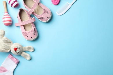Photo of Flat lay composition with baby accessories and toys on color background. Space for text