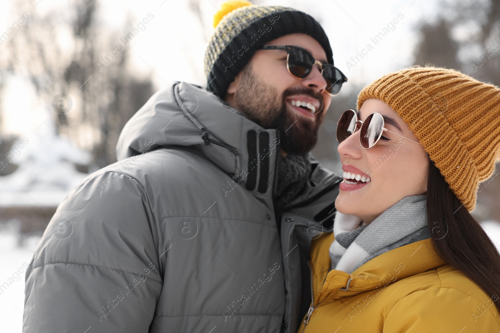 Photo of Beautiful happy couple spending time together on winter day