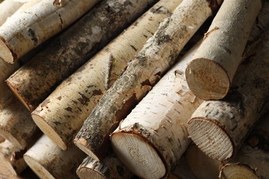 Photo of Cut firewood as background, above view. Heating in winter