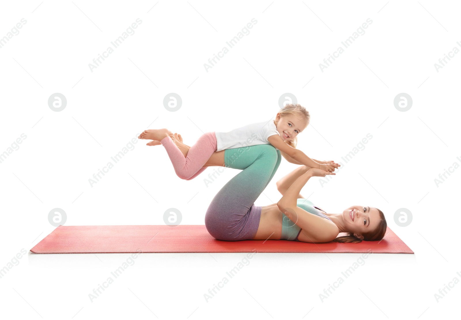 Photo of Young woman and her daughter doing exercise isolated on white. Home fitness