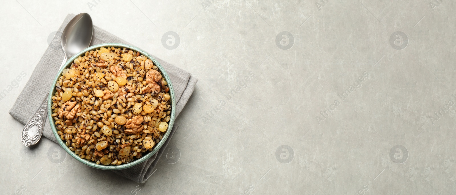 Image of Traditional Christmas slavic dish kutia served on light grey table, top view with space for text. Banner design