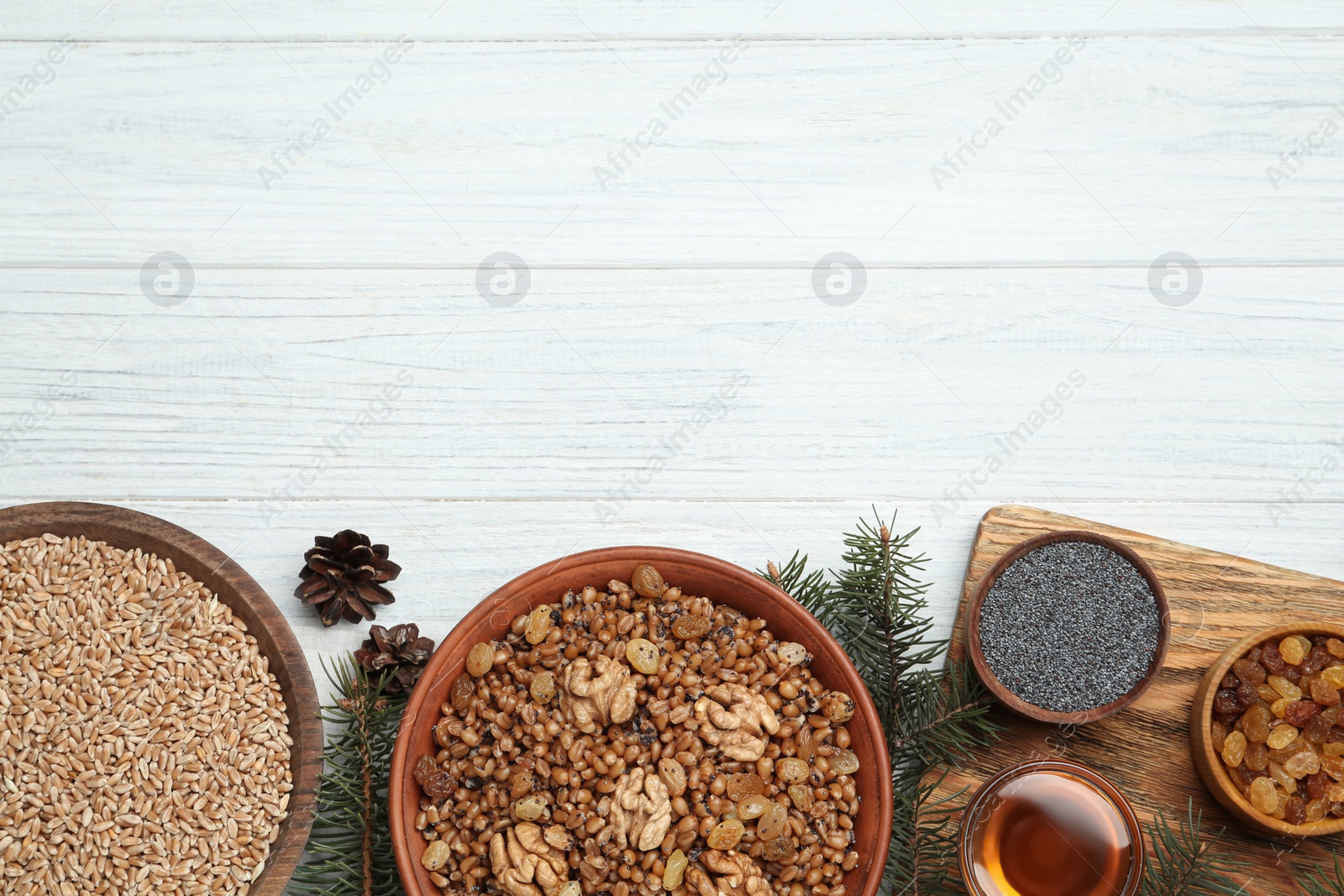 Photo of Traditional Christmas slavic dish kutia served on white wooden table, flat lay. Space for text