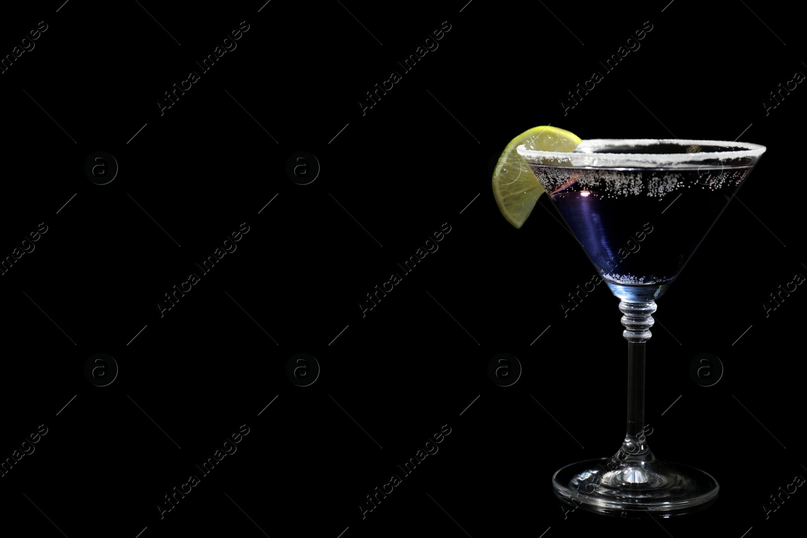 Photo of Glass of delicious cocktail on black background. Space for text