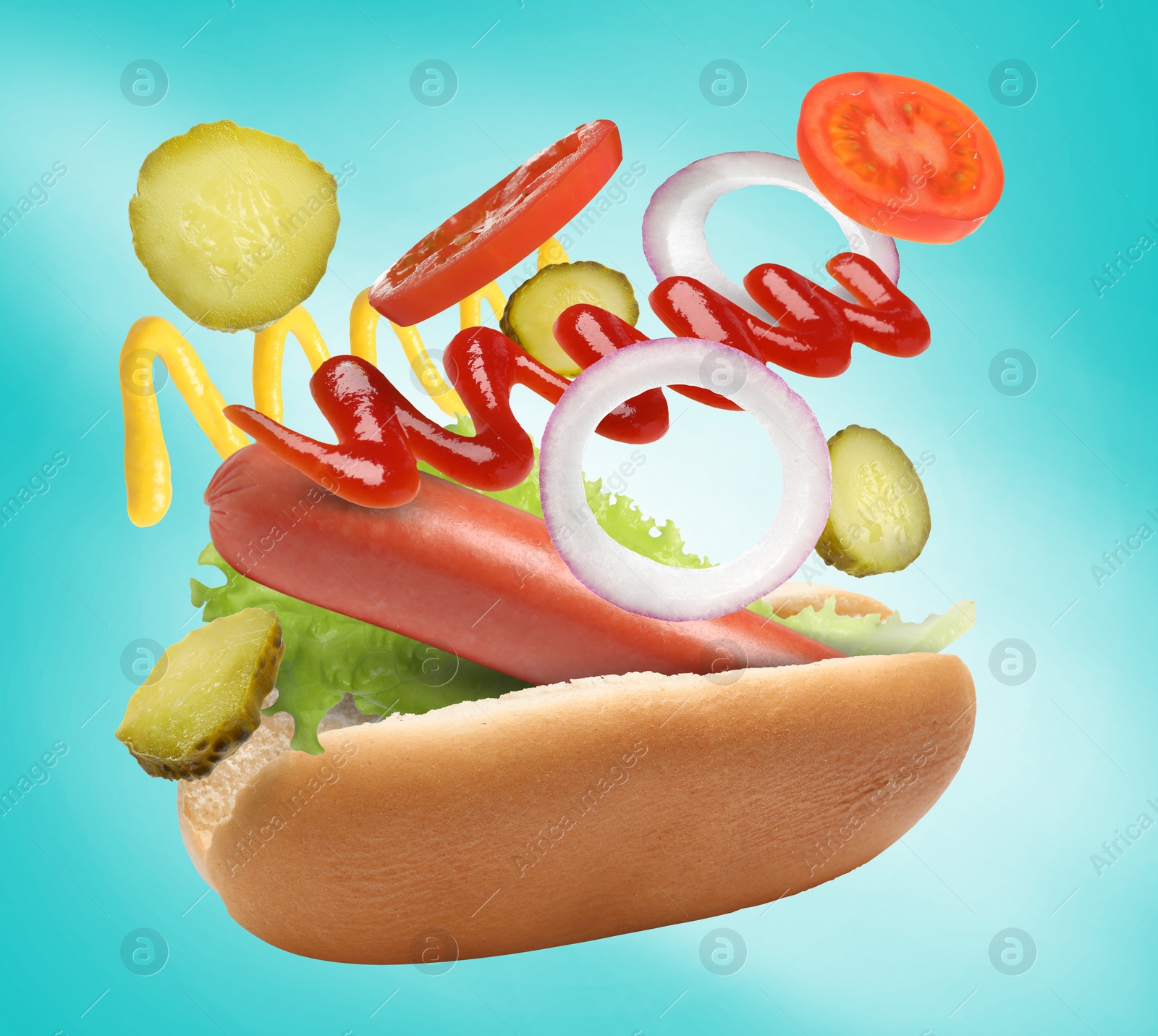 Image of Hot dog ingredients in air on light blue gradient background