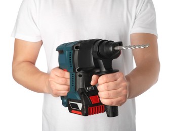Man holding modern electric power drill on white background, closeup