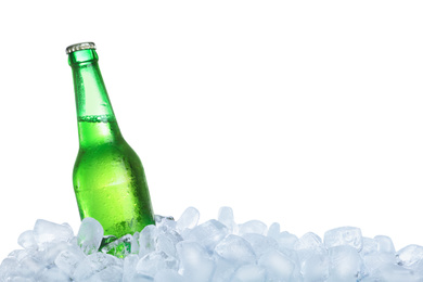 Photo of Ice cubes and bottle on white background