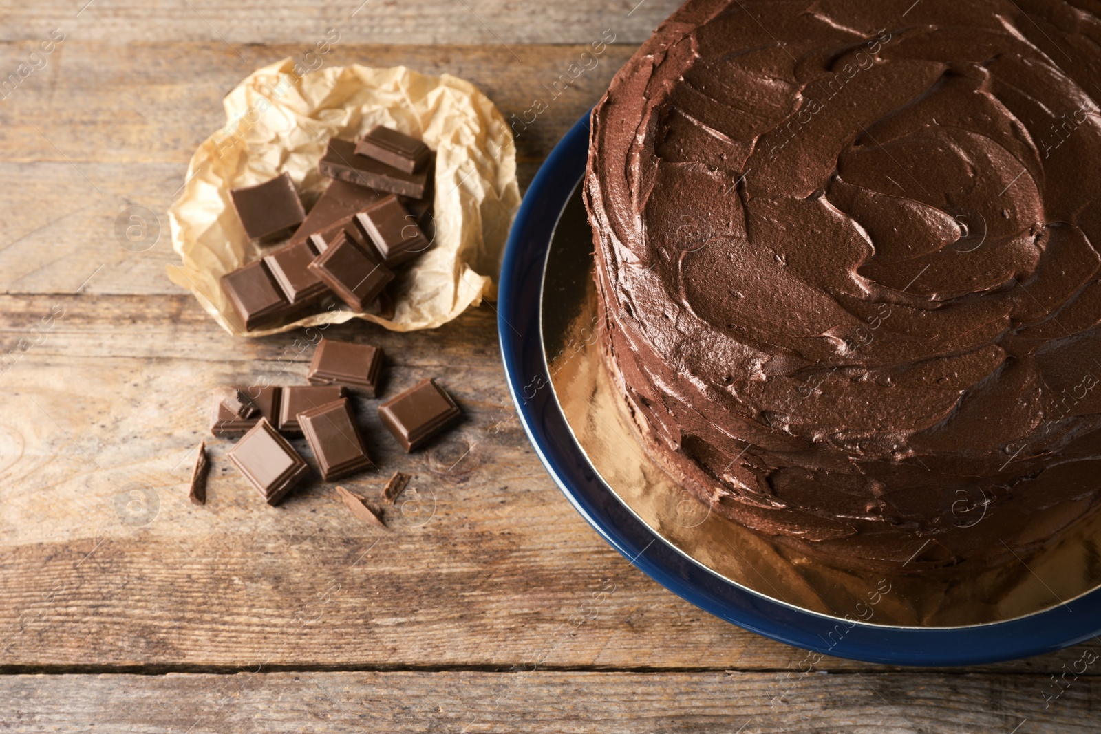 Photo of Composition with tasty homemade chocolate cake on wooden background