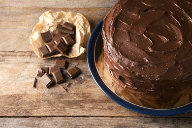 Composition with tasty homemade chocolate cake on wooden background