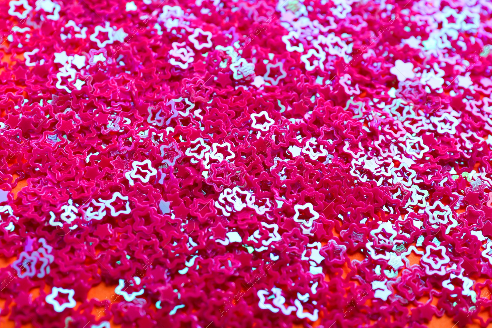 Photo of Shiny bright pink glitter as background, closeup