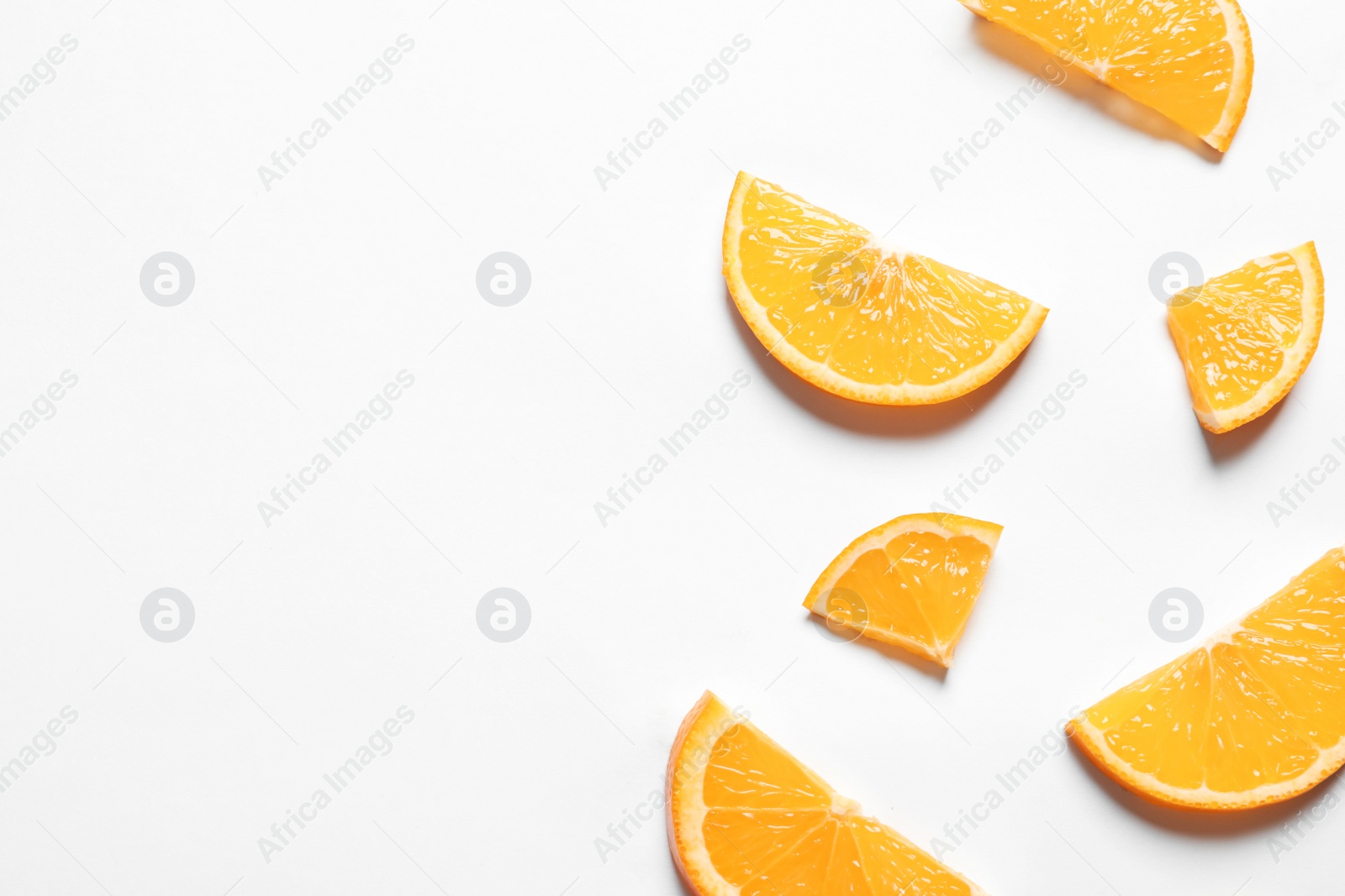 Photo of Composition with orange slices on white background, top view