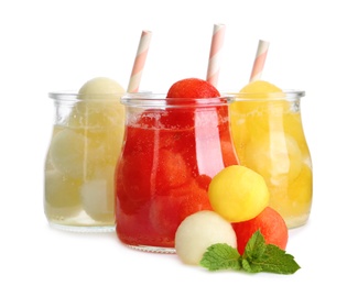Photo of Glass jars of melon and watermelon ball cocktails on white background