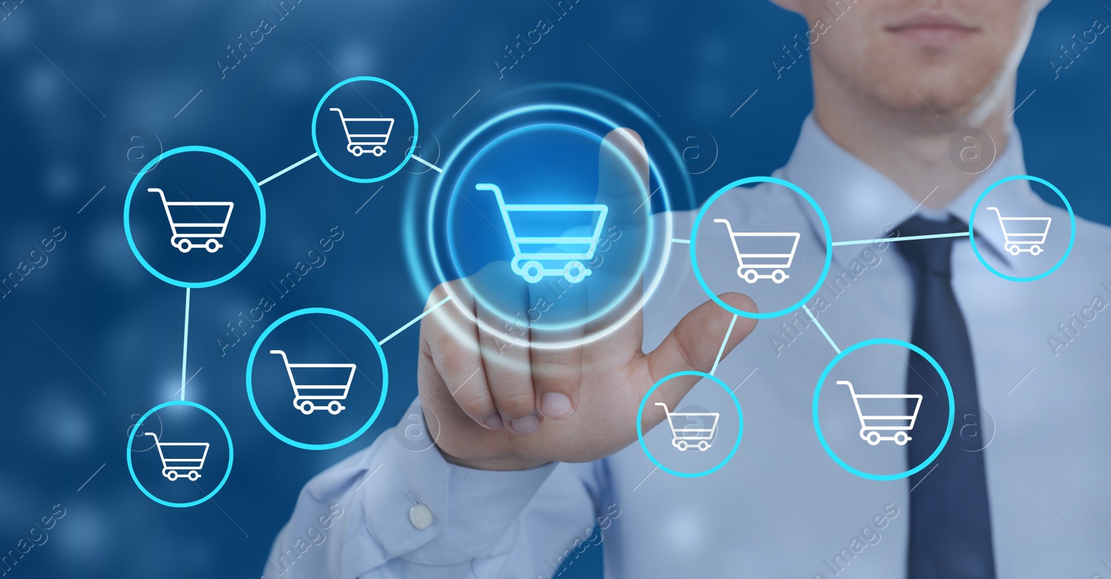 Image of Man pointing at icons of shopping carts on virtual screen, closeup. Online store