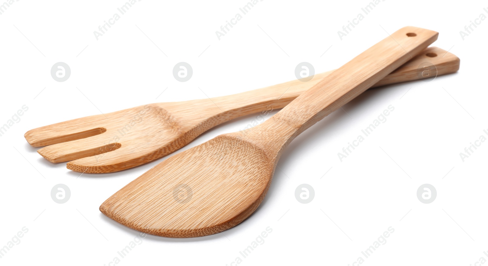 Photo of Kitchen utensils made of bamboo on white background