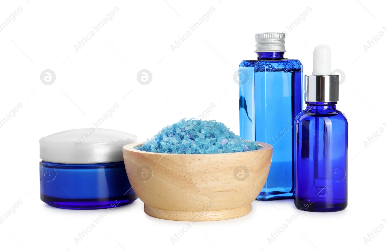 Photo of Spa composition. Cosmetic products and sea salt isolated on white