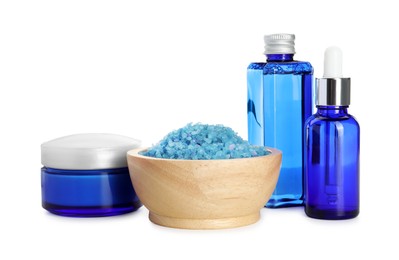 Photo of Spa composition. Cosmetic products and sea salt isolated on white