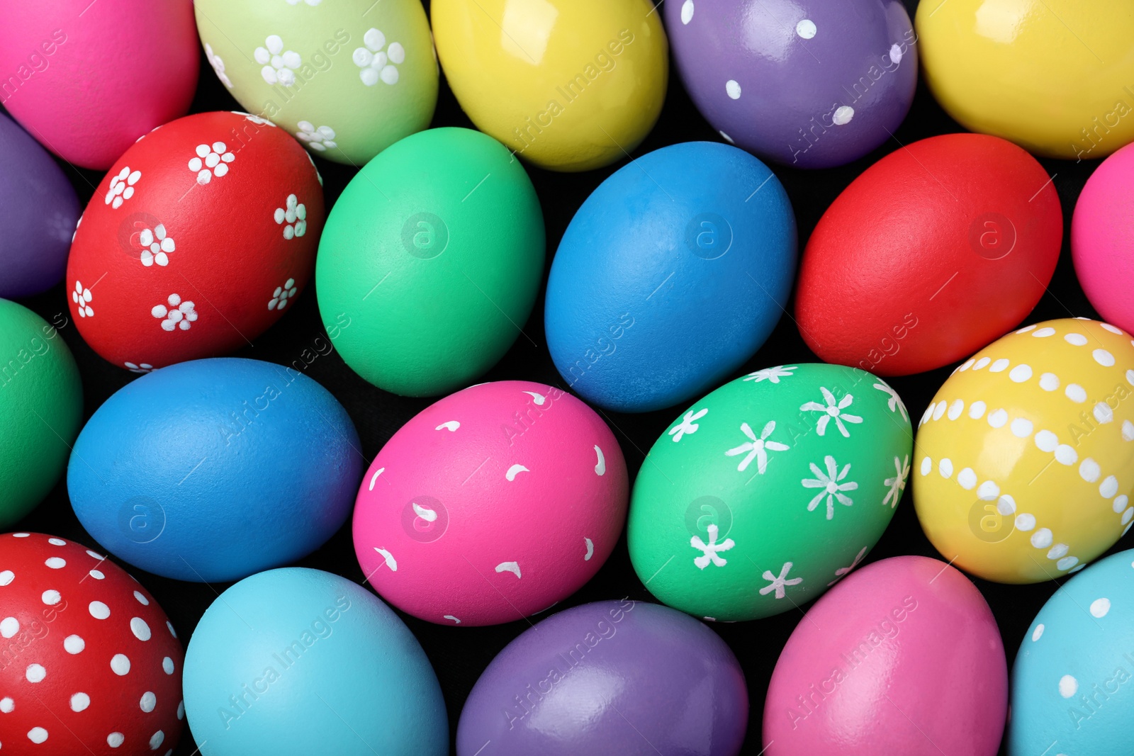 Photo of Colorful eggs as background, top view. Happy Easter