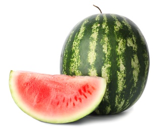 Whole and sliced ripe watermelon on white background