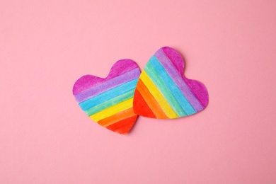 Rainbow hearts on color background, top view. Gay symbol