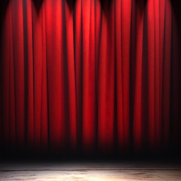 Image of Empty wooden stage and closed red curtains
