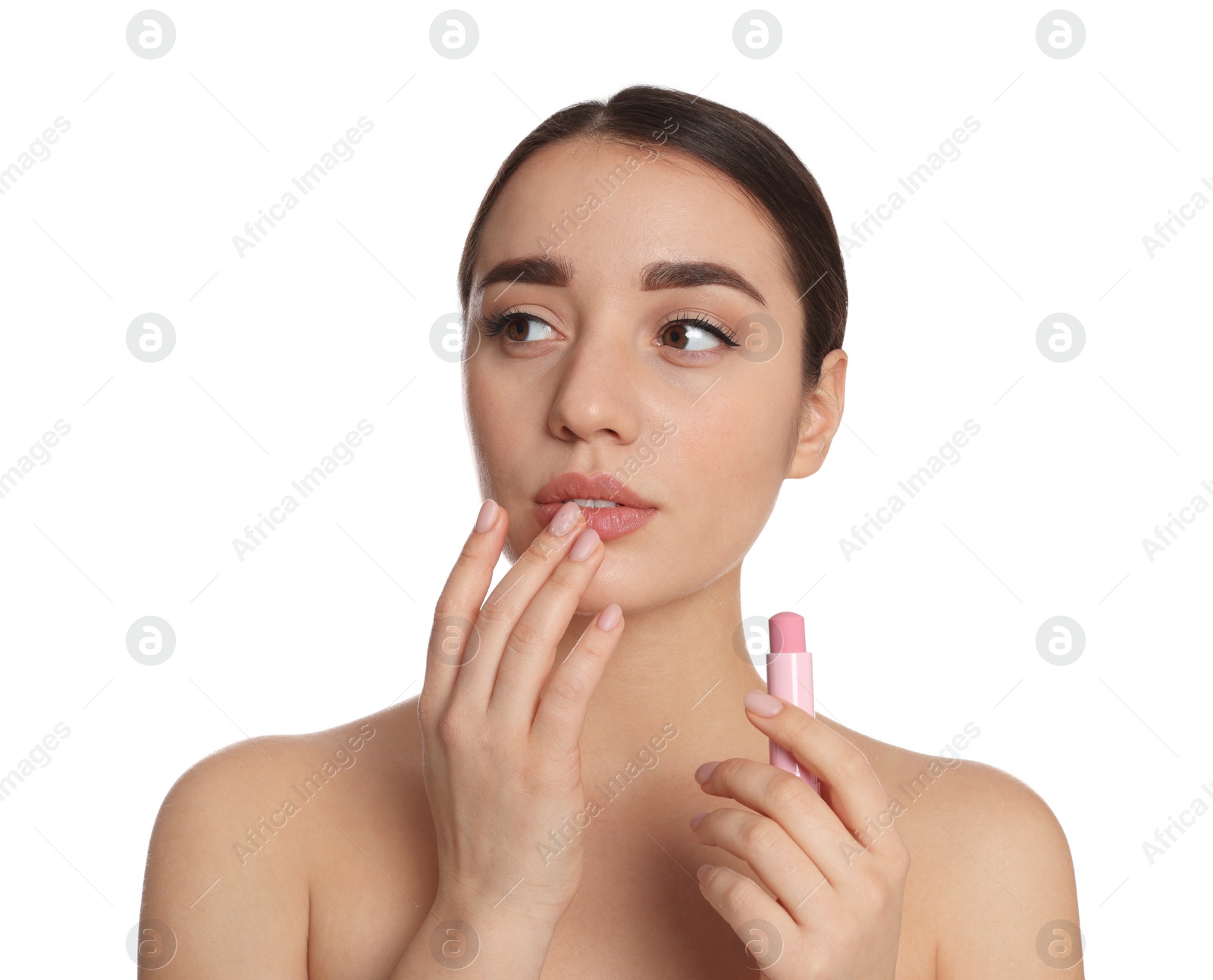 Photo of Young woman with lip balm on white background